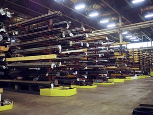 Sullivan Steel warehouse racks holding various sizes of steel bar and tube
