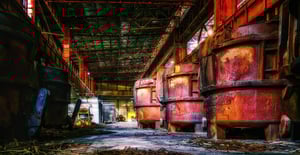 Heavy duty steel mill slag pots holding molten alloy steel.